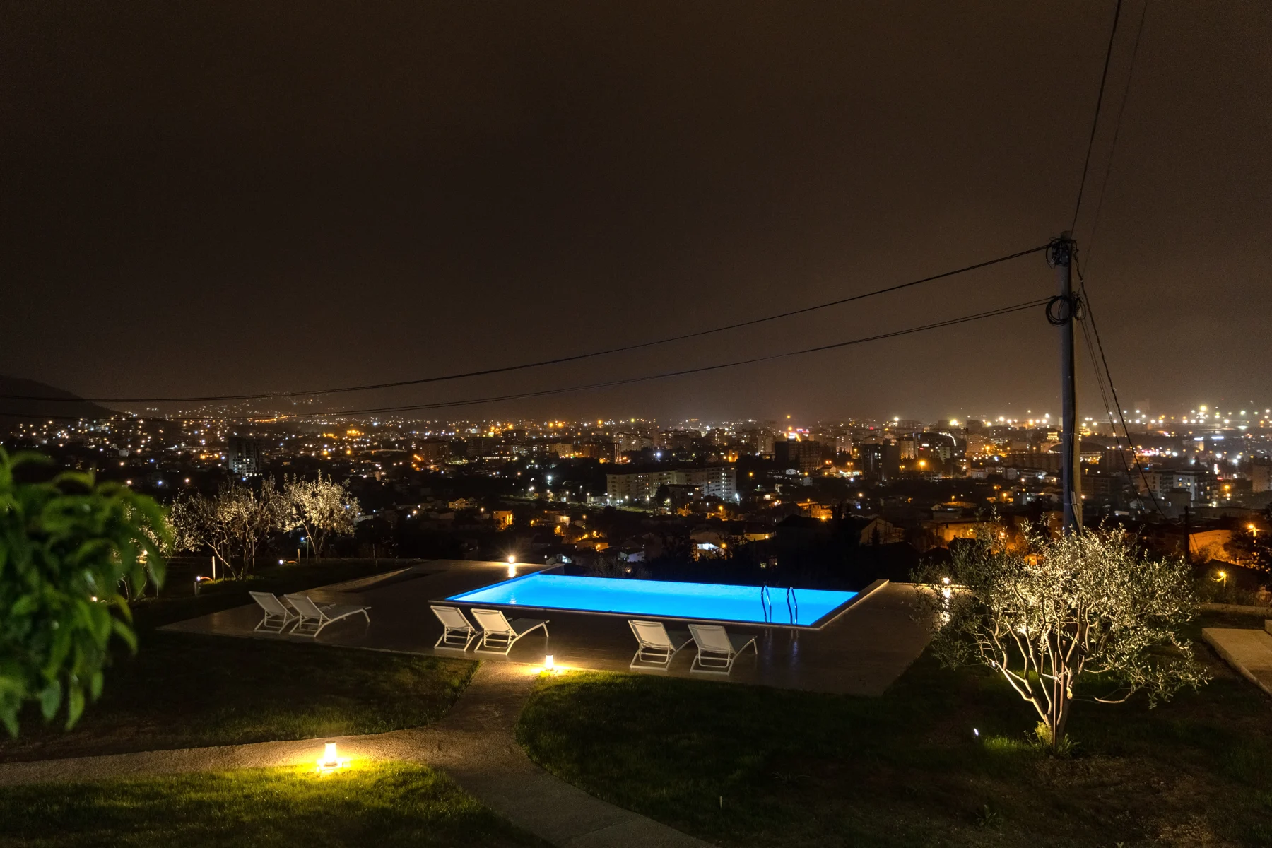 Infinity pool overlooking Bar at night